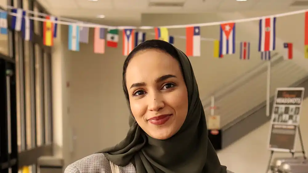 World Language and Culture faculty member poses for a picture during the Hispanic Heritage Celebration.