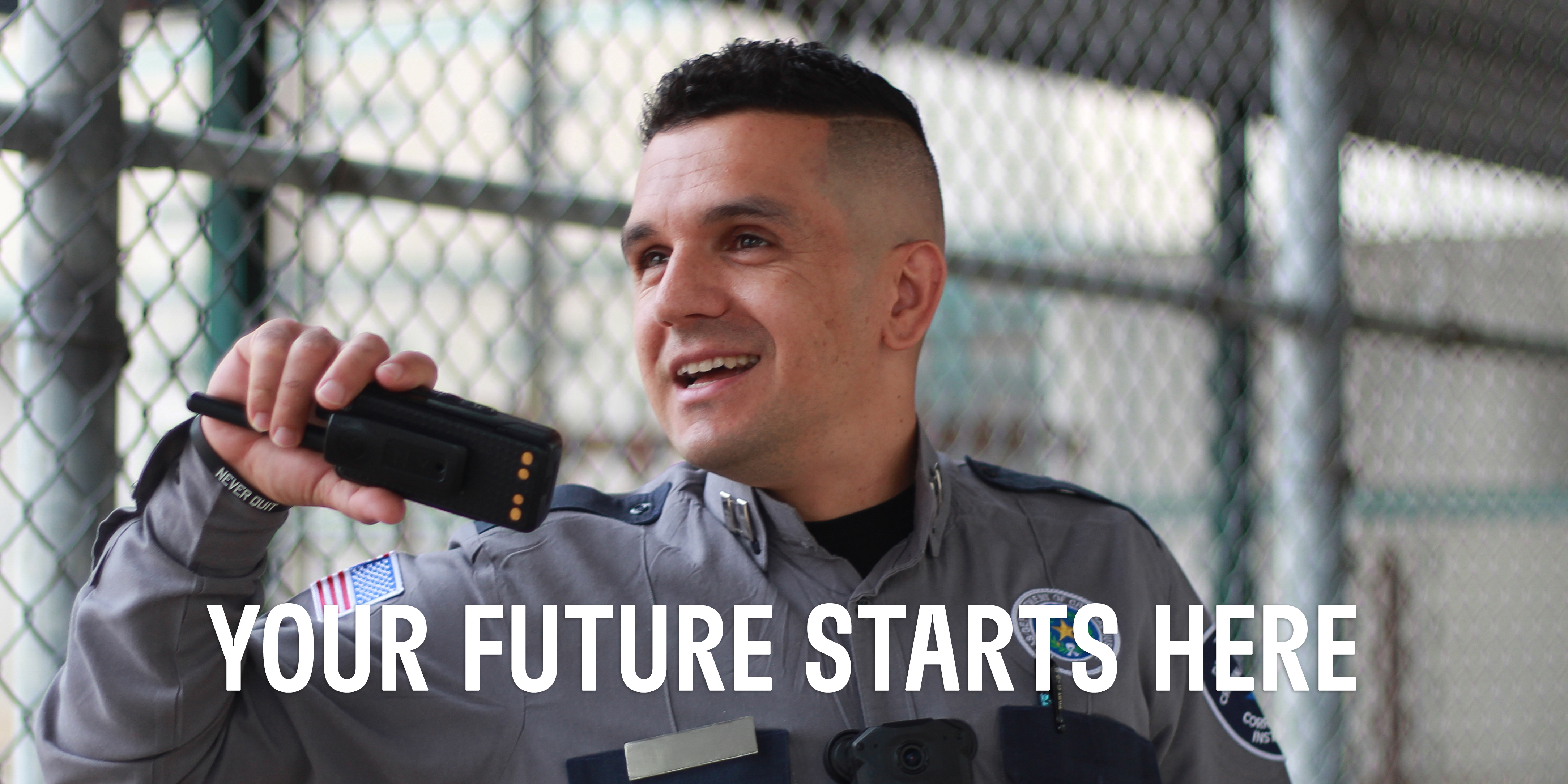 Corrections officer in uniform speaking on 2-way radio with a text overlay headline that says "Your Future Starts Here."