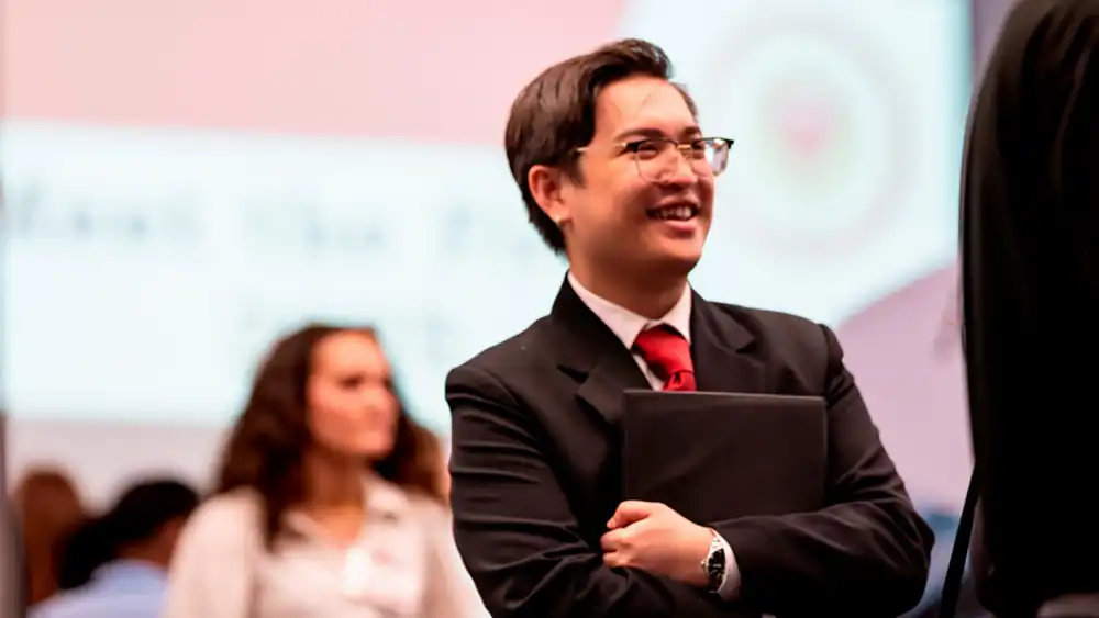 Student listening in a group of people