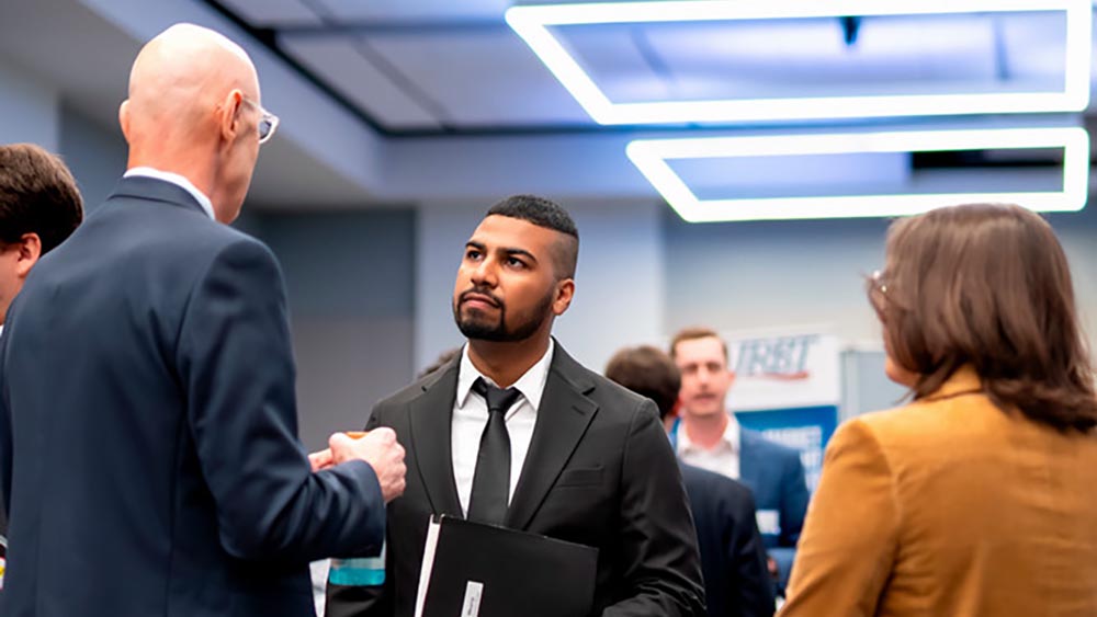 Accounting student listening to faculty