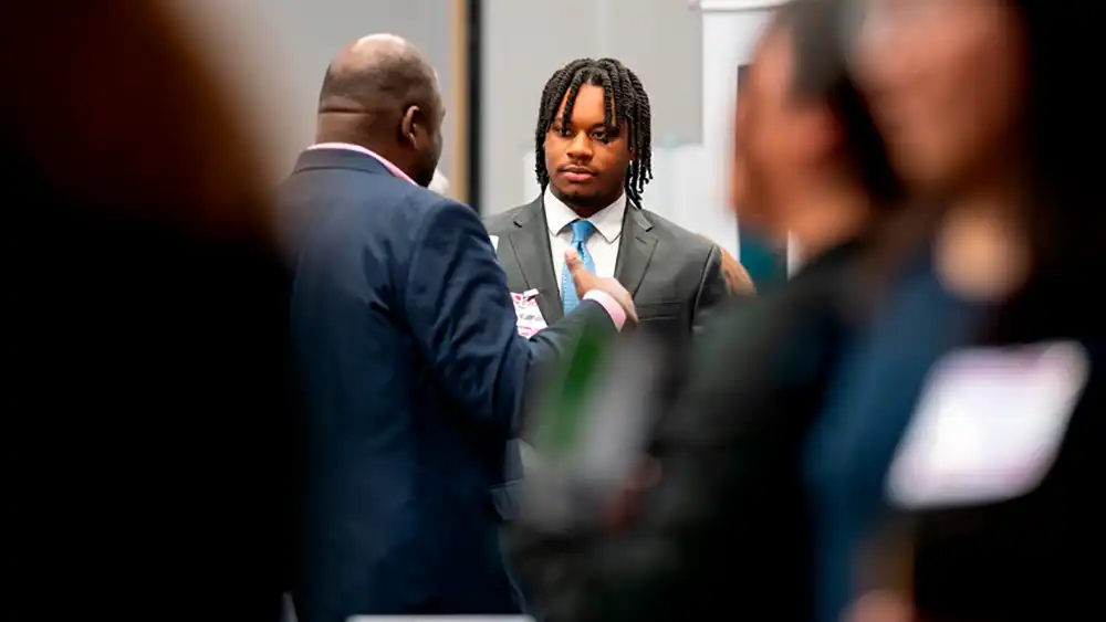 Student listening to Professor