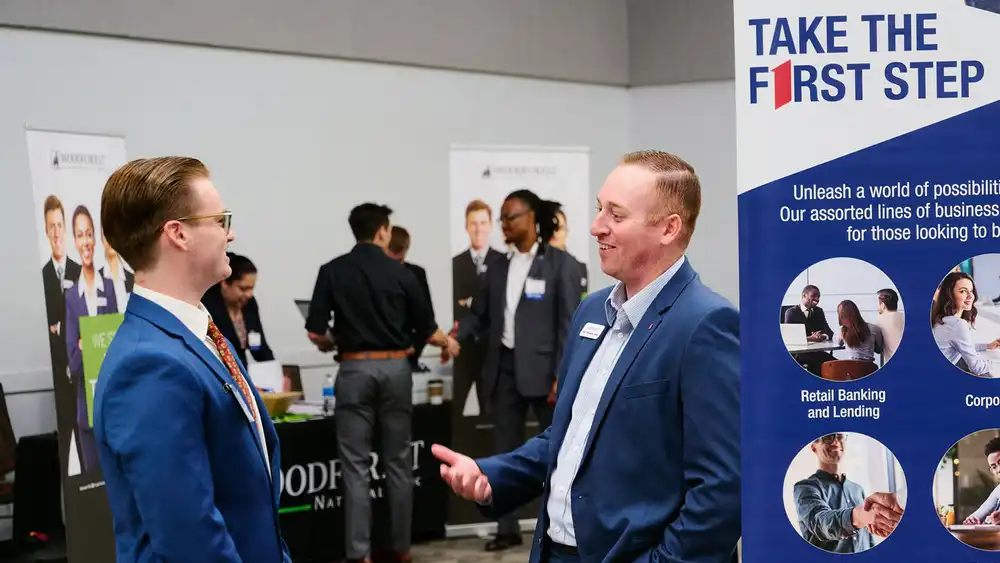 Student speaking with an employer