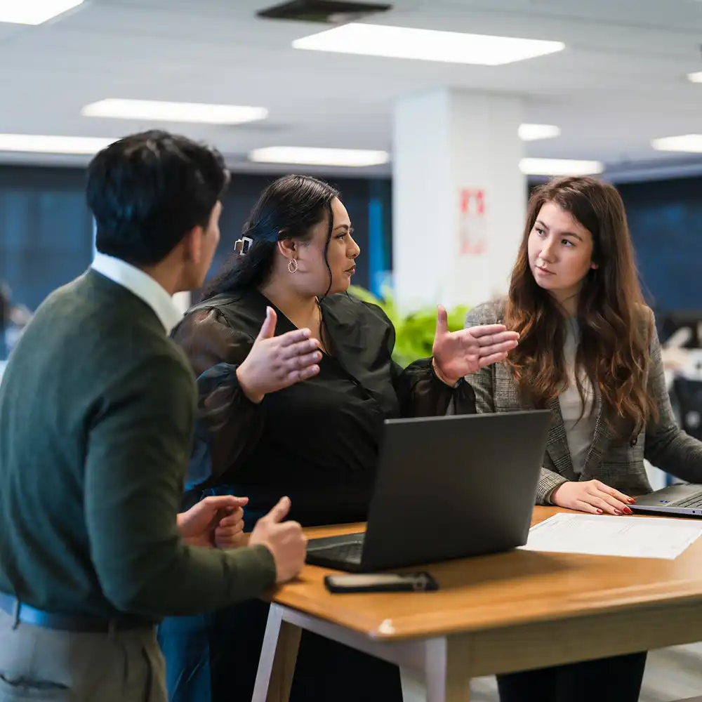 Students gathered around a table and working together. 