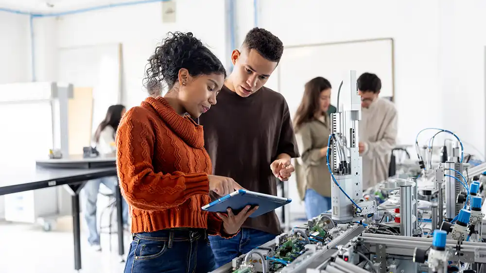 Man and woman working together on a computer. 