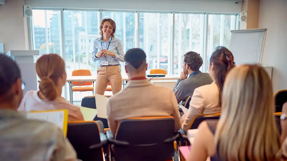 Professor teaching in front of seated students