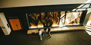 Man in suit talking to another man