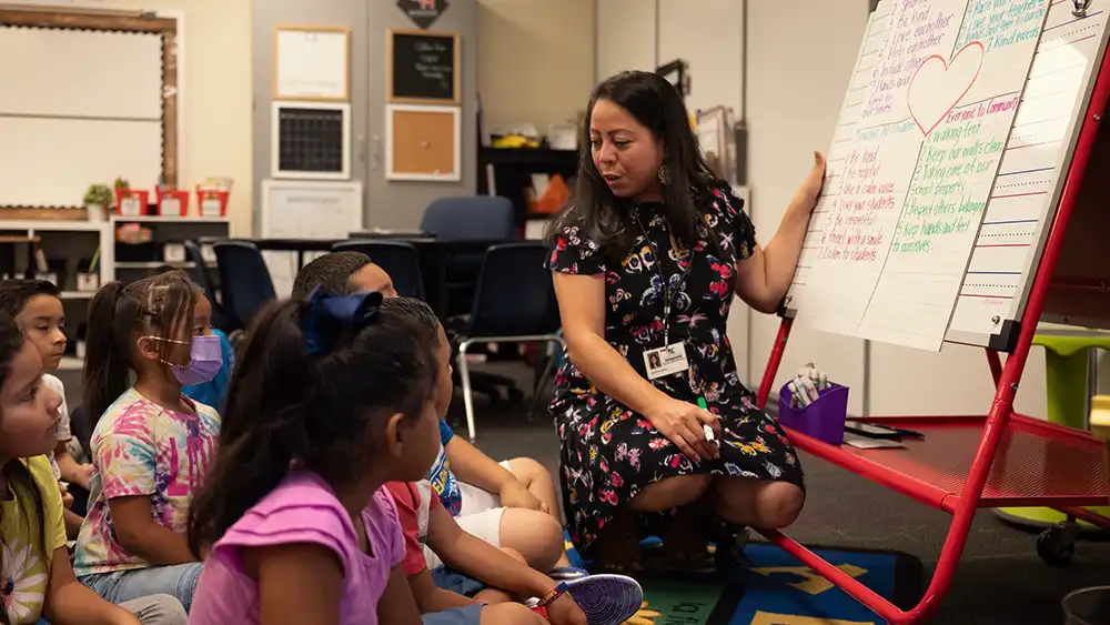 Man in suit talking to another man