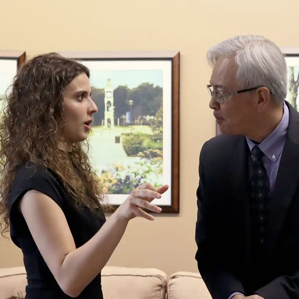 SHSU students deep in discussion outside of the Lowman Student Center.