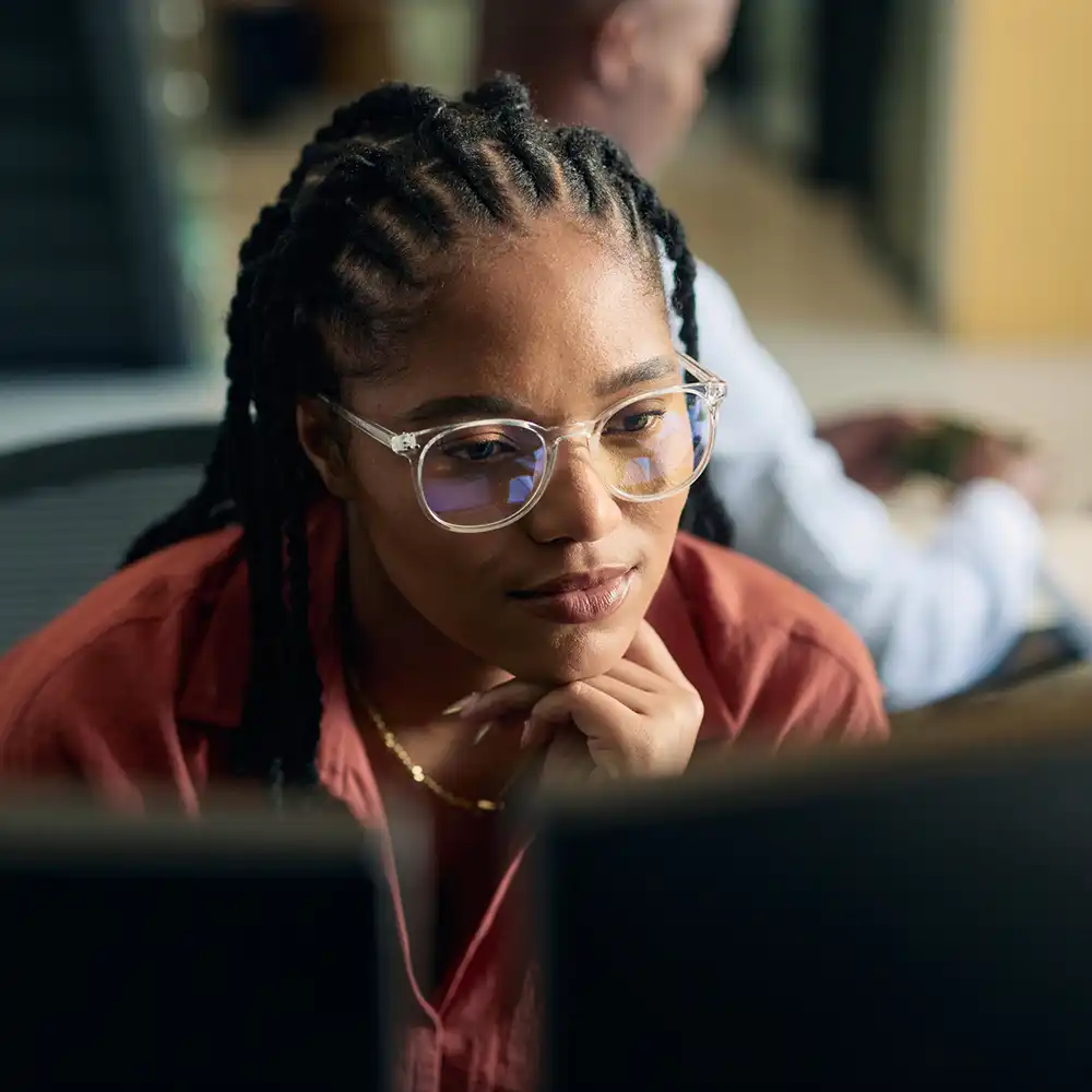Woman looking at a computer.