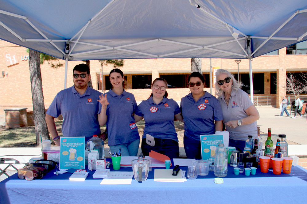 Man in suit talking to another man