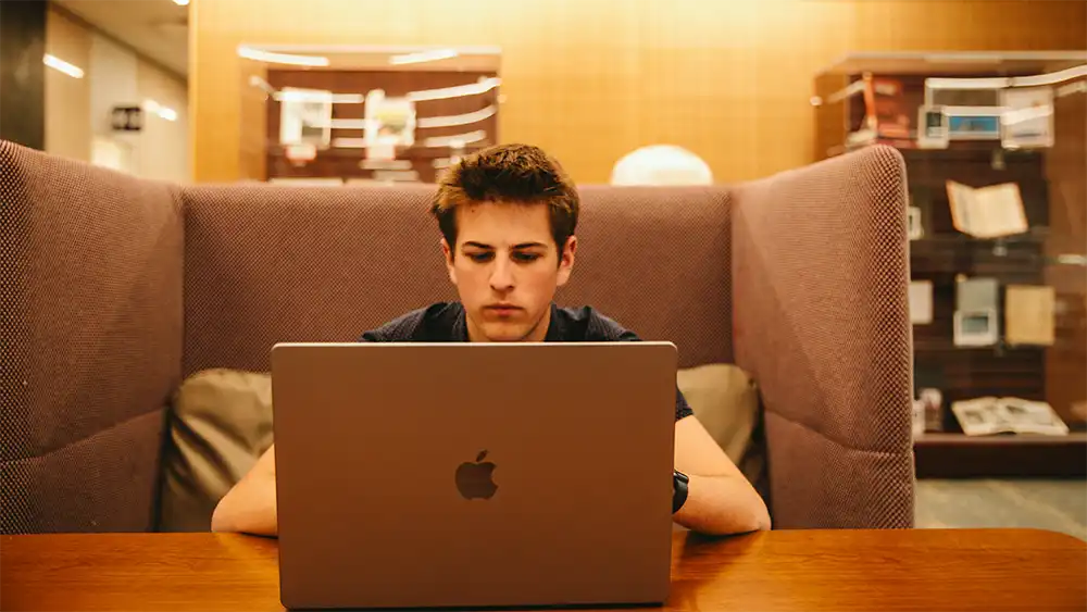 Man in suit talking to another man