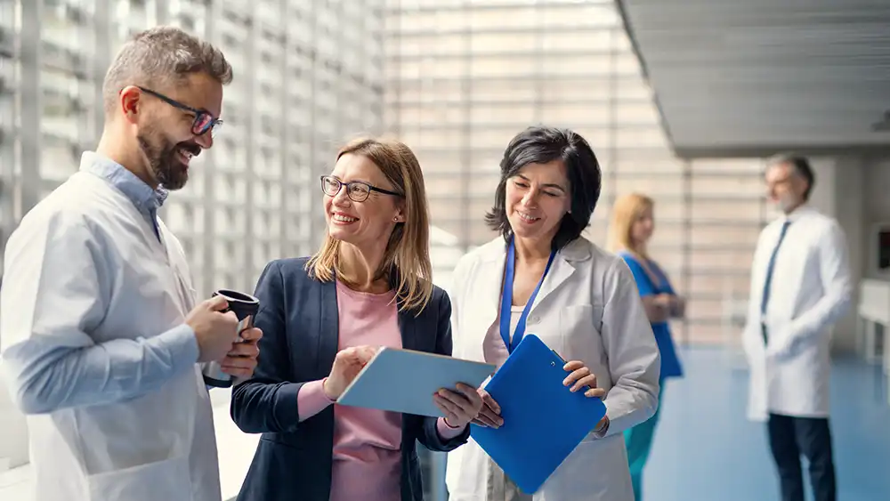 Man in suit talking to another man