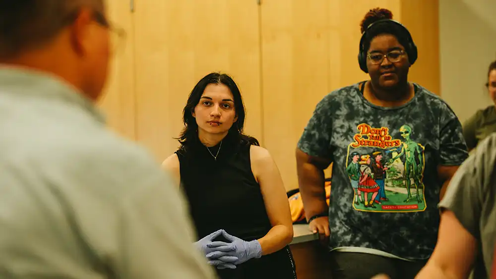 Man in suit talking to another man