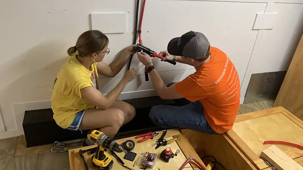 Man in suit talking to another man