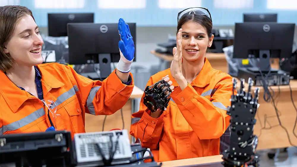 Girl engineer in robot industry fabrication research room