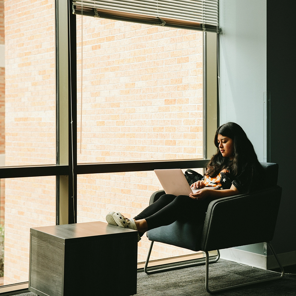 SHSU Student working remotely on their laptop