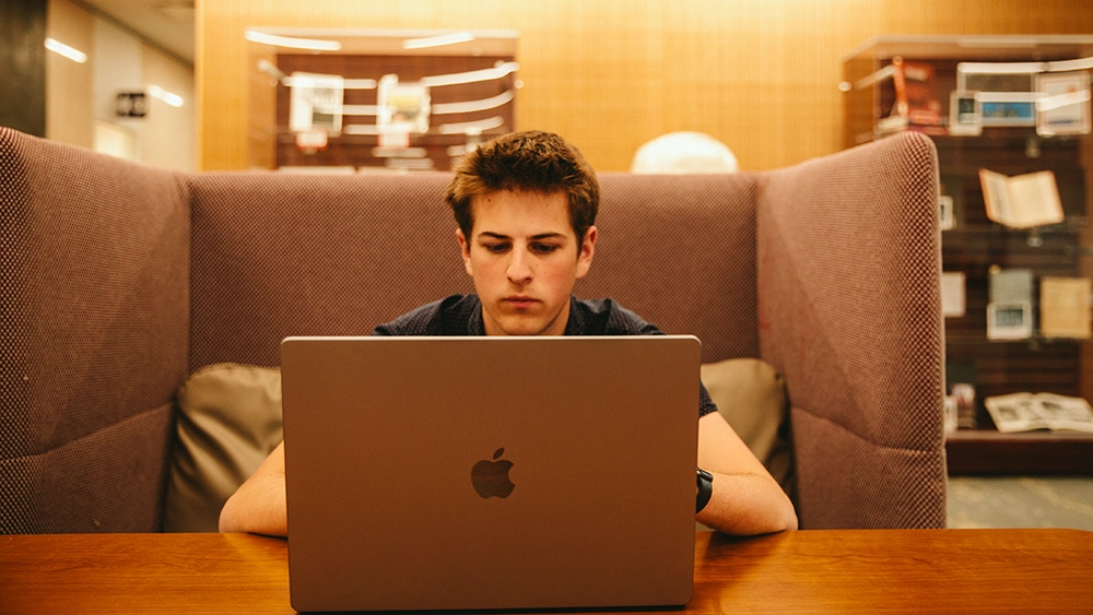 Student looking at a laptop