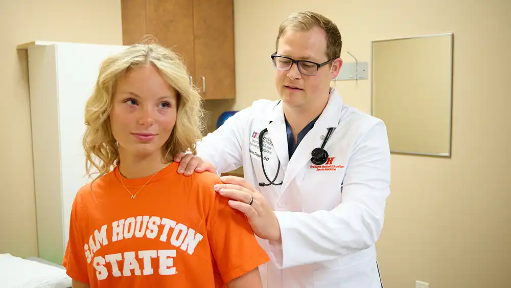 Man in suit talking to another man