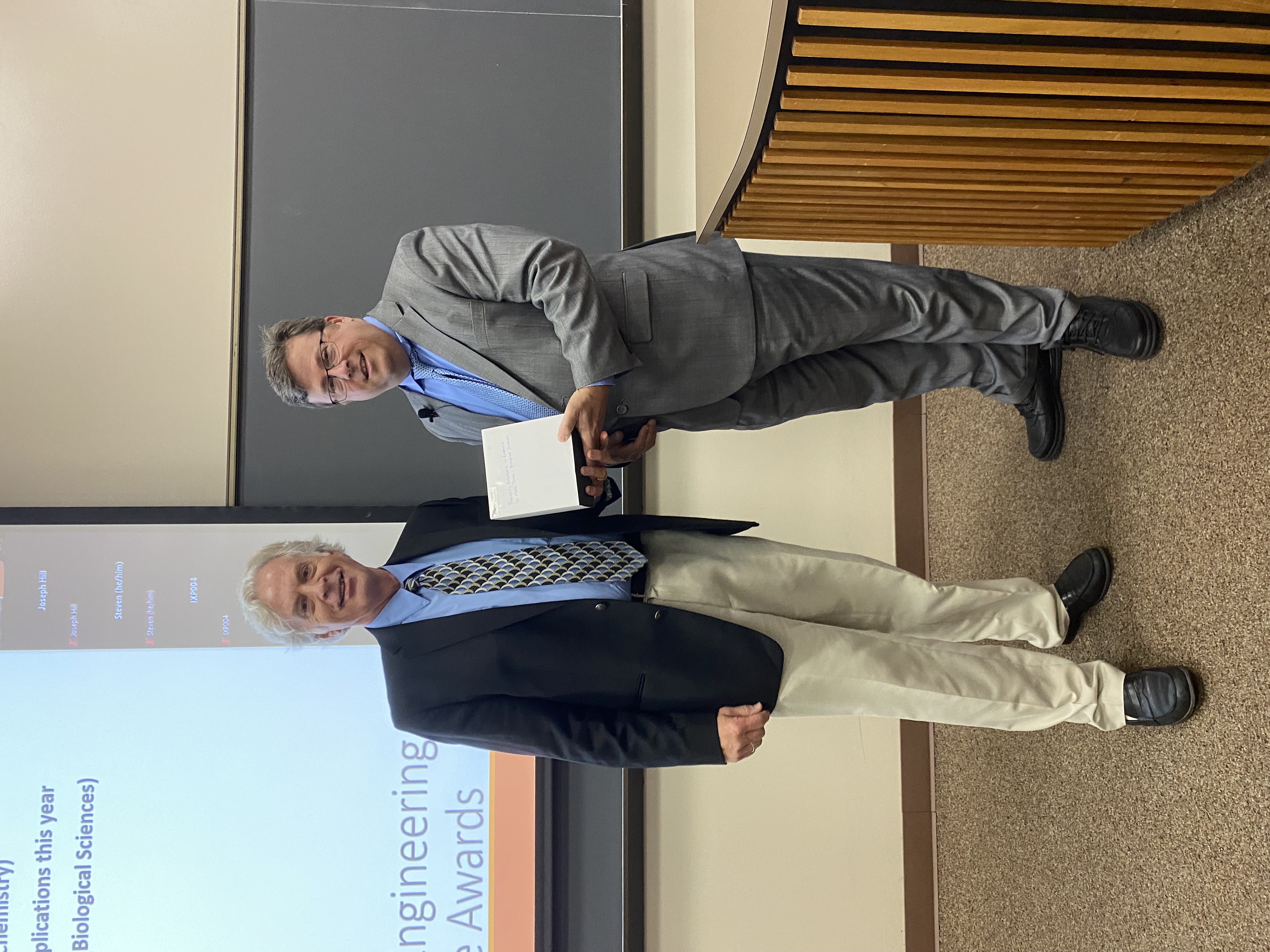 Dr. Monte Thies accepts his award from Dean John Pascarella