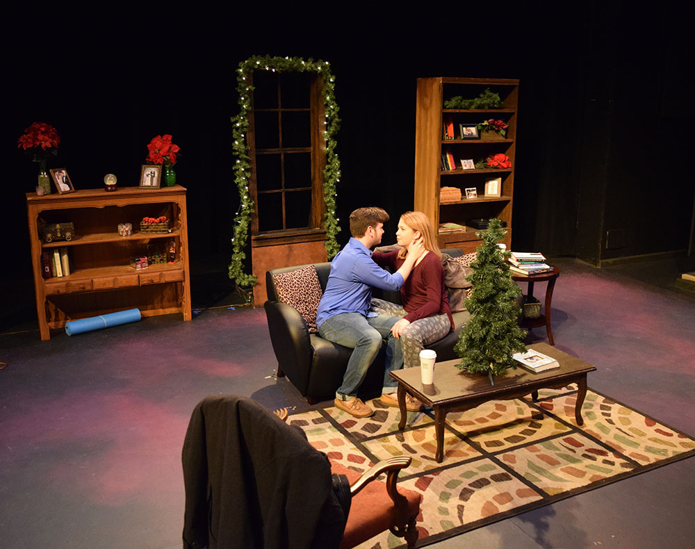 SHSU theatre actors on stage looking into each other's eyes in  Baltimore Waltz