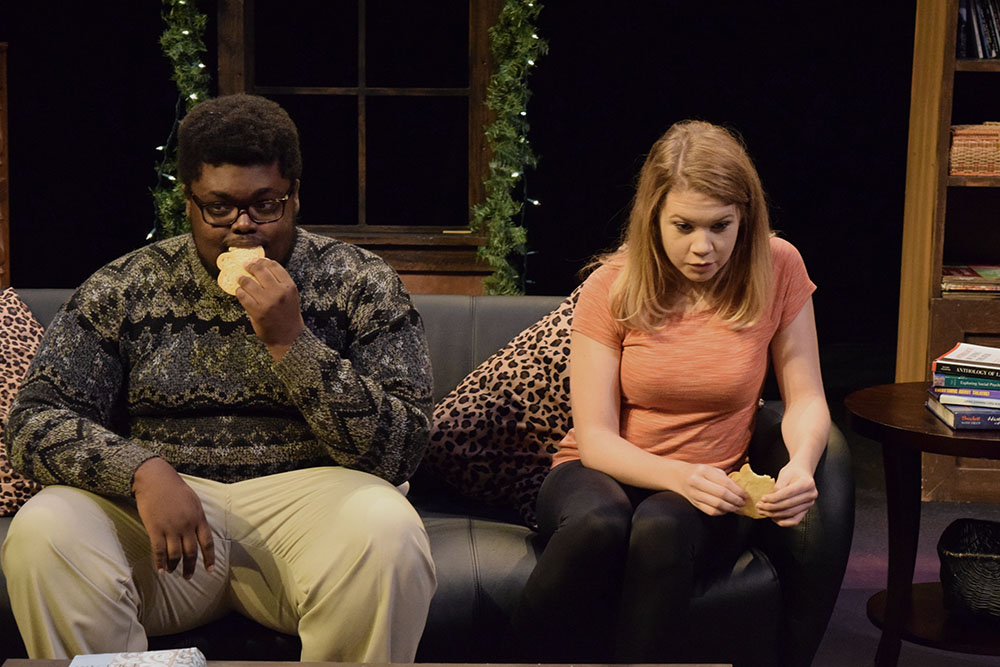 SHSU theatre actors eating on the couch in  Baltimore Waltz