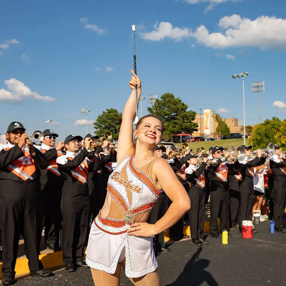 Bearkat Marching Band and twirler during Bearkat Alley at Homecoming Game