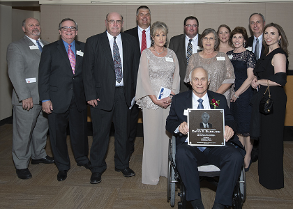 Barnard and many others pose with his plaque