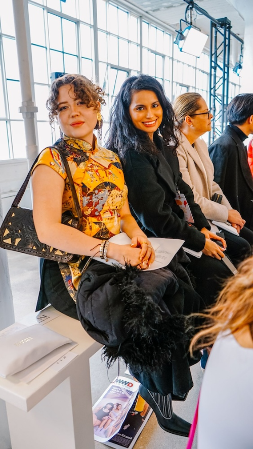 Carlena Blanco (center) sits with her fellow UofNYFW attendees.