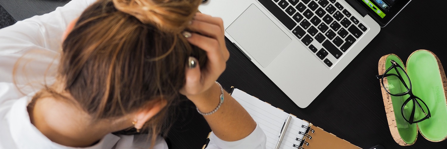 Woman depicted being stressed from work