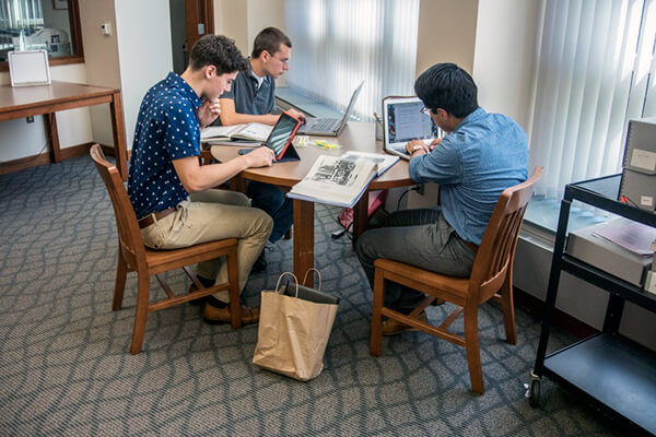 students studying at a round table