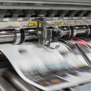 close up of printer pushing out printed page