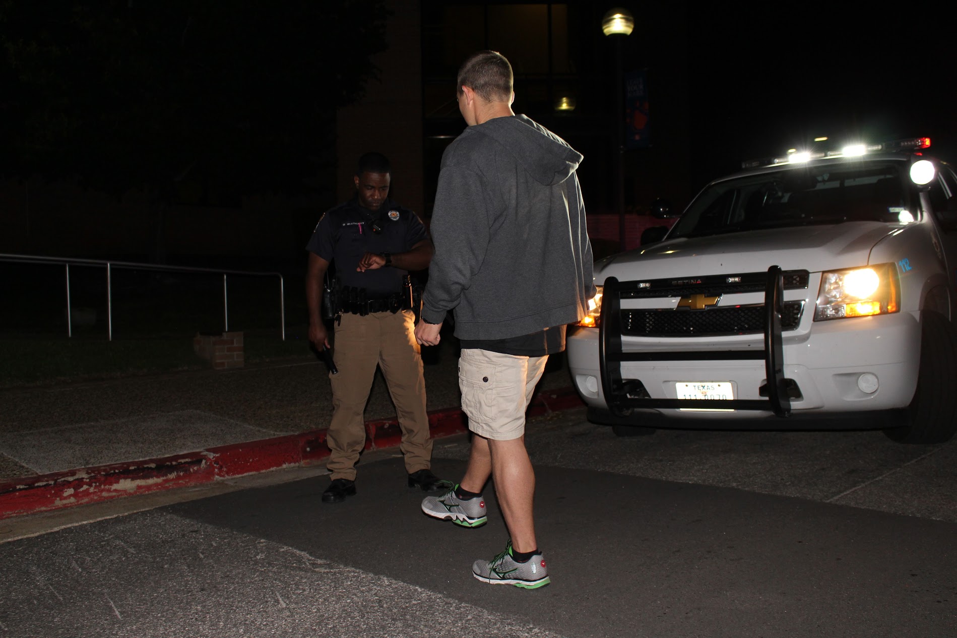 Officer conducts DWI test at night