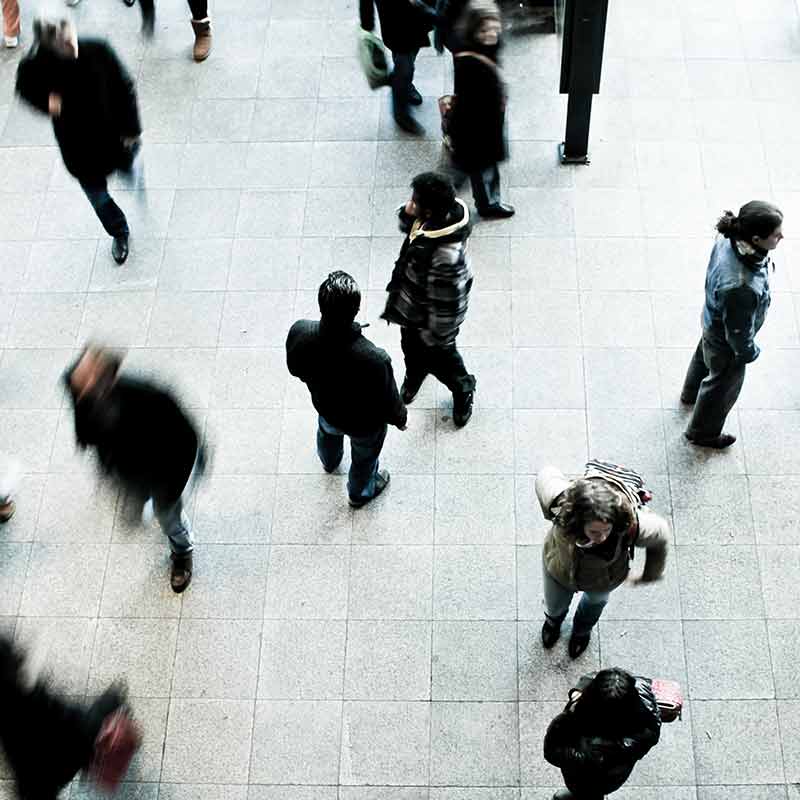 Photo by Timon Studler, Unsplash 2 still people while people move quickly around them