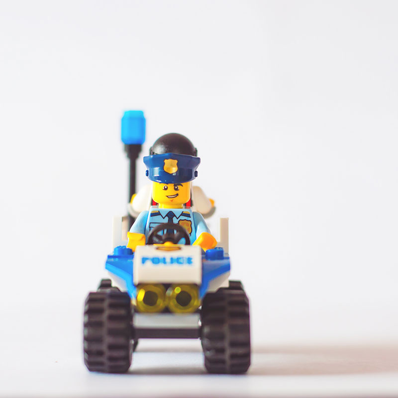 Photo by Praveesh Palakeel, Unsplash police car and officer built from legos