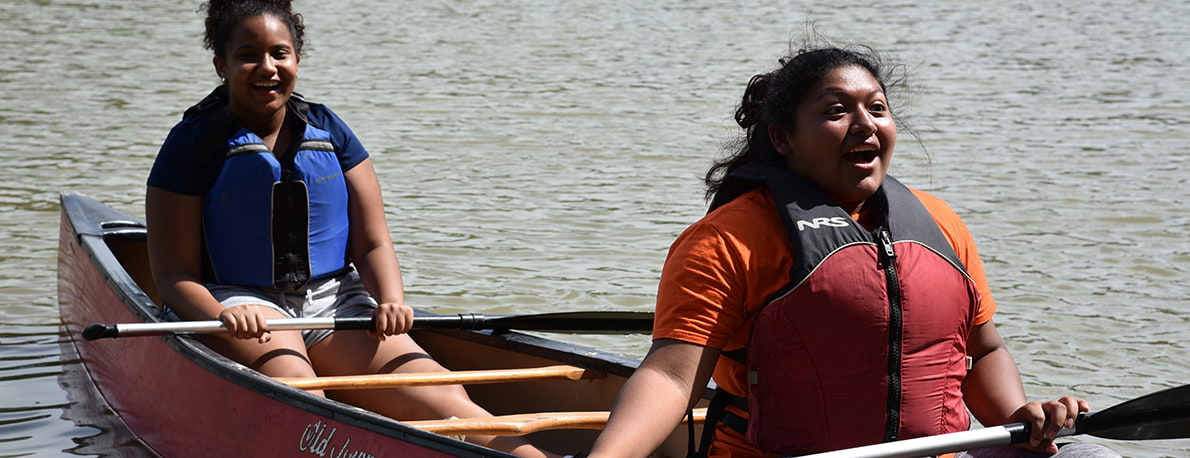 Students Kayaking on a River