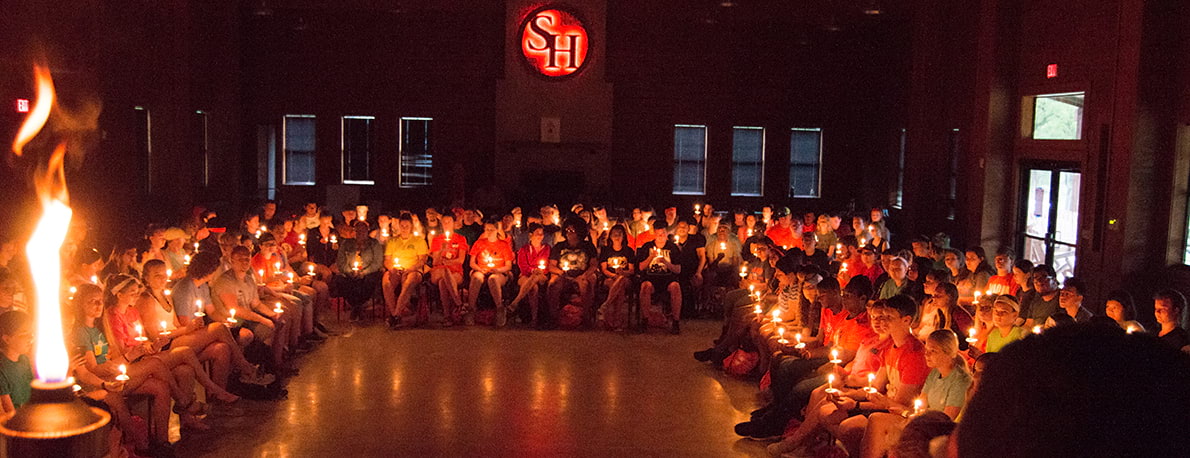 campers participating in candlelight ceremony