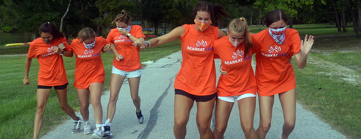 campers participating in a race with facemasks