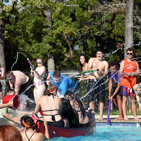 campers in pool playing pool battleship