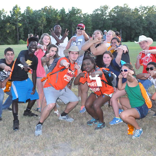 camp counselors posing for photo with campers