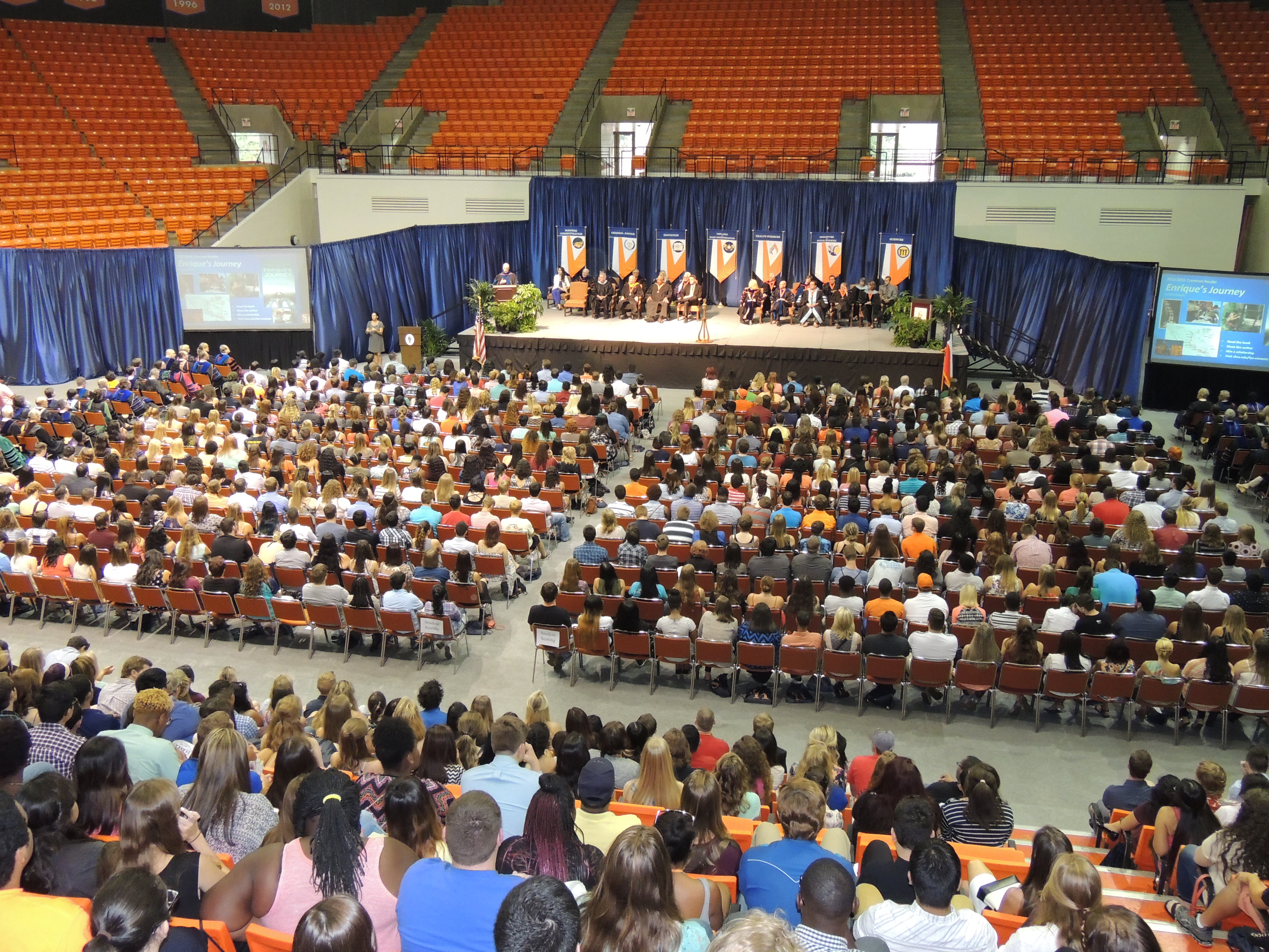 A large number of students gather in the Johnson Coliseum for New Student Convocation.