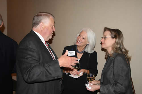 Charles Rushing visits with Dean Brown and Elizabeth Norwood