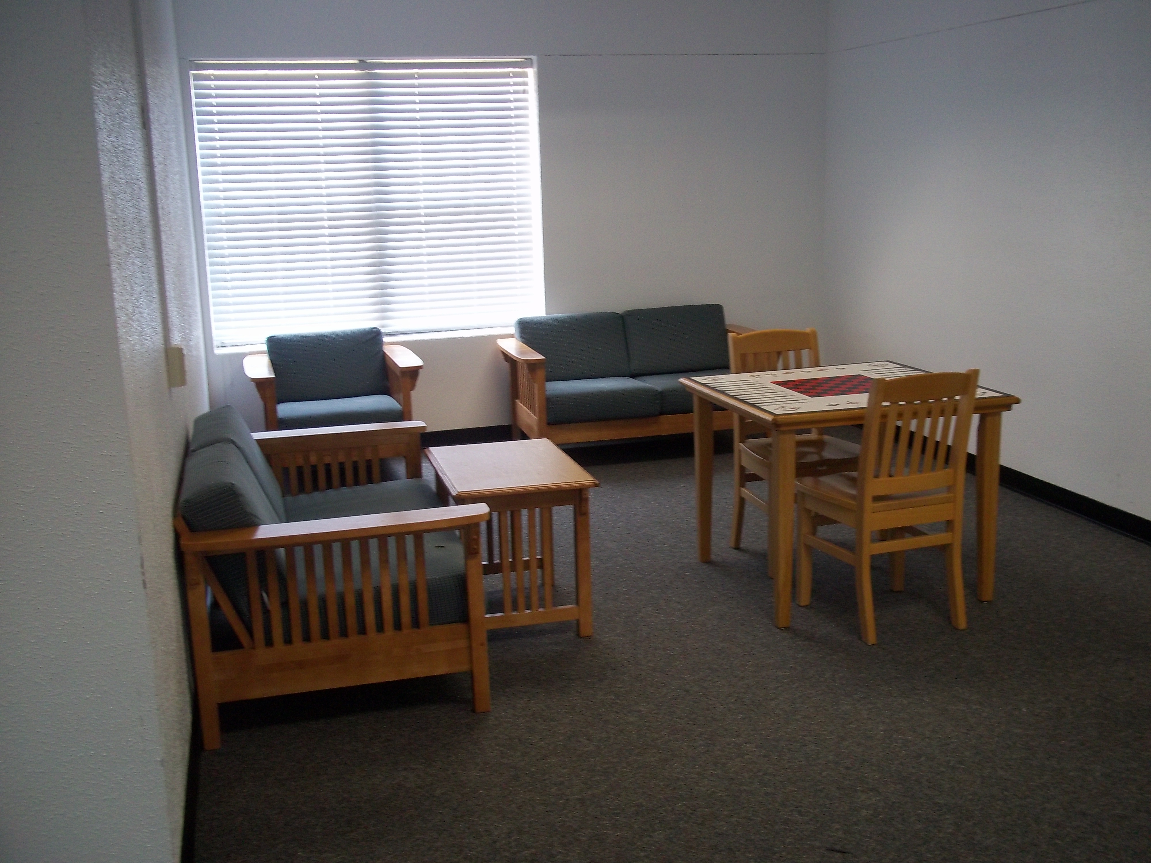 Chess board and couches in common area.