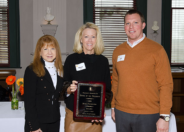 Kathy Gilcrease, Dana Hoyt, and J.R. Ohr posing with their award plaque