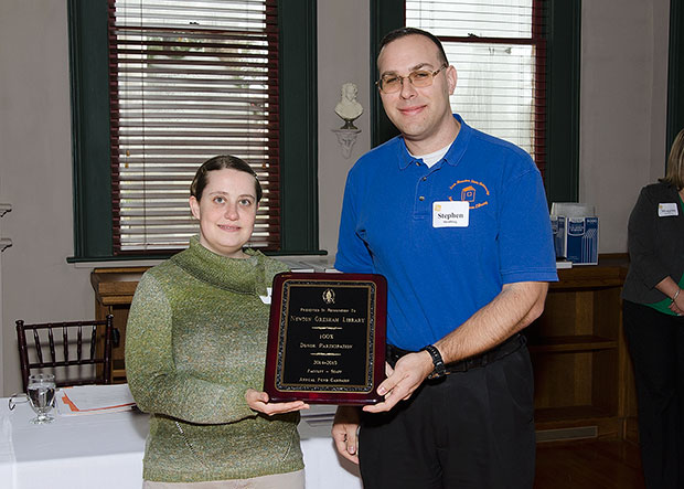 Erin Cassidy and Stephen Strubing posing with their award plaque