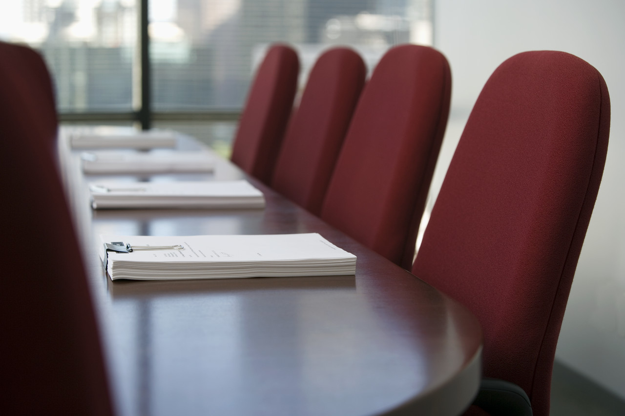 a table and chairs set for a meeting