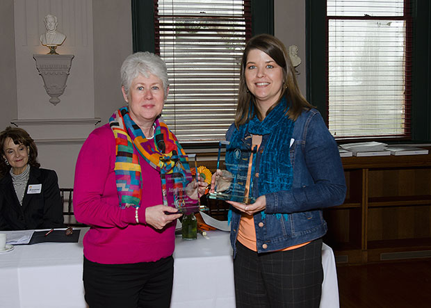 Ann Broussard and AManda Burns posing with their awards