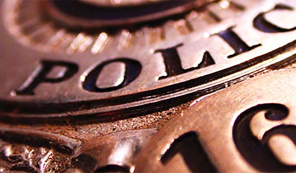 Close-up image of a police badge.