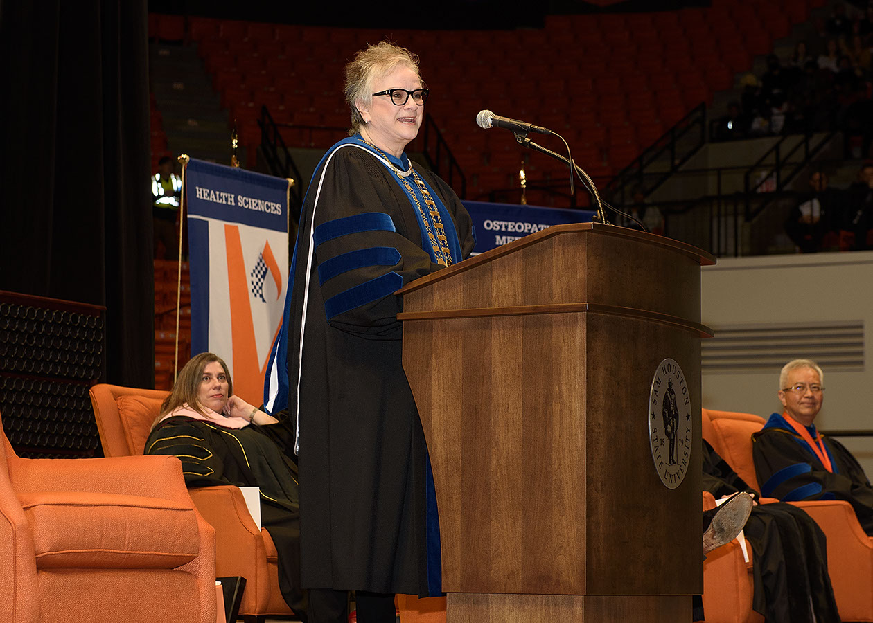 President Alisa White delivers an address to graduates and their families.