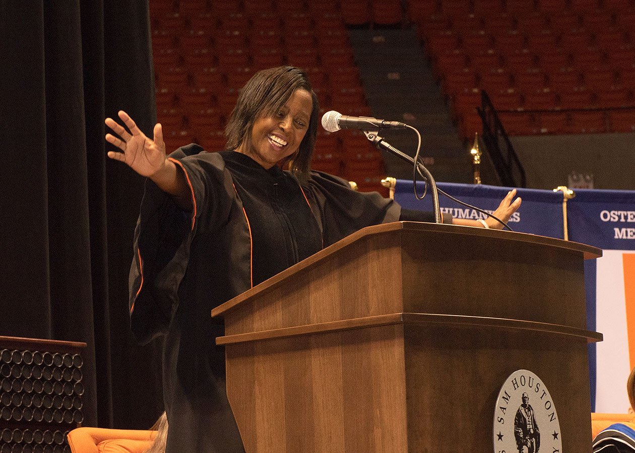 Commencement Speaker Wanda Smith makes grand gestures during her Commencement Address.