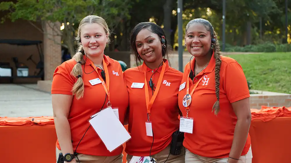 Three students at a table.